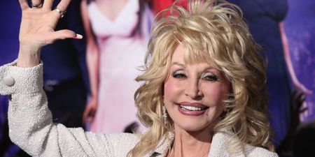 Dolly Parton is selling Christmas cards posing at the Ha’penny Bridge