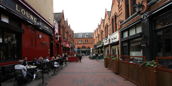 castle market in dublin, with red brick pavement and pubs and restaurants on either side