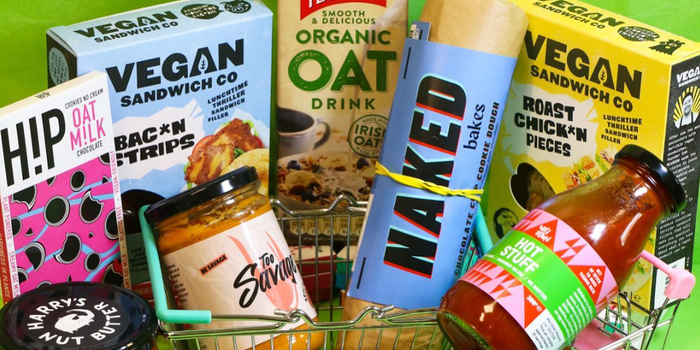 a selection of vegan and plant based products against a green background