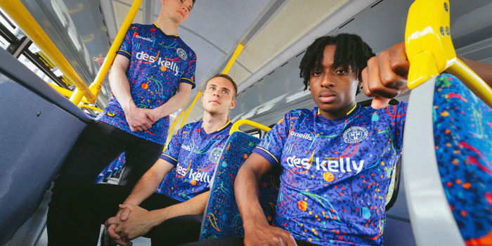three men on dublin bus wearing bohs jerseys with the dublin bus seat print
