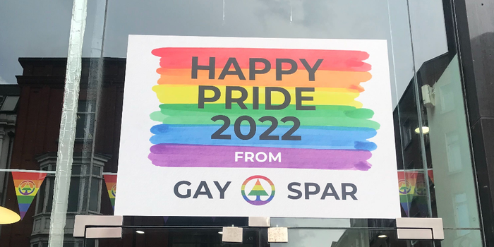 rainbow coloured sign in a shop window which reads "Happy Pride 2022 from Gay Spar"