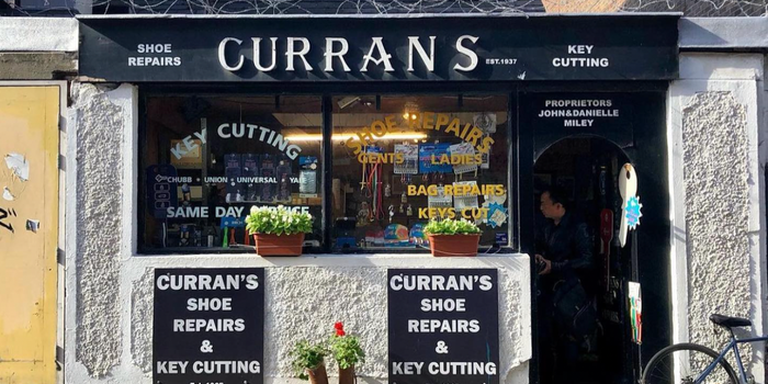 shop front of curran's shoe repair shop
