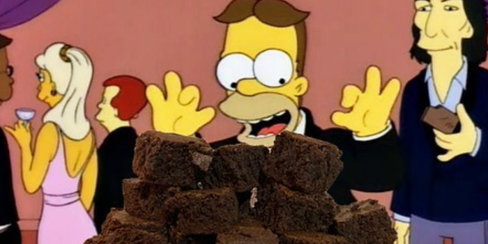 homer simpson at a party looking excited about a plate piled with brownies