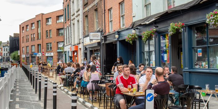 people eating and drinking on tables outside Capel Street pub
