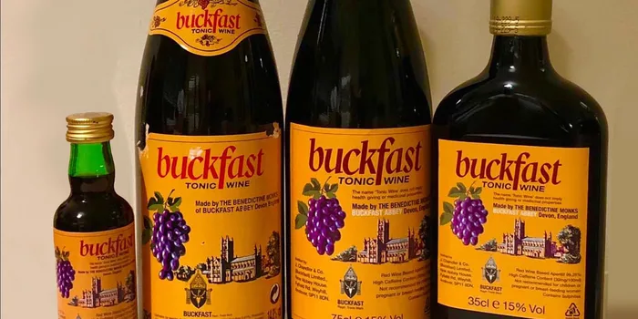 four bottles of buckfast in an assortment of sizes