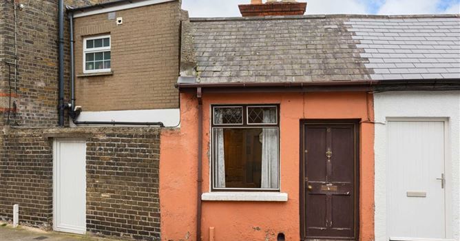 exterior of a tiny cottage for sale in rathmines
